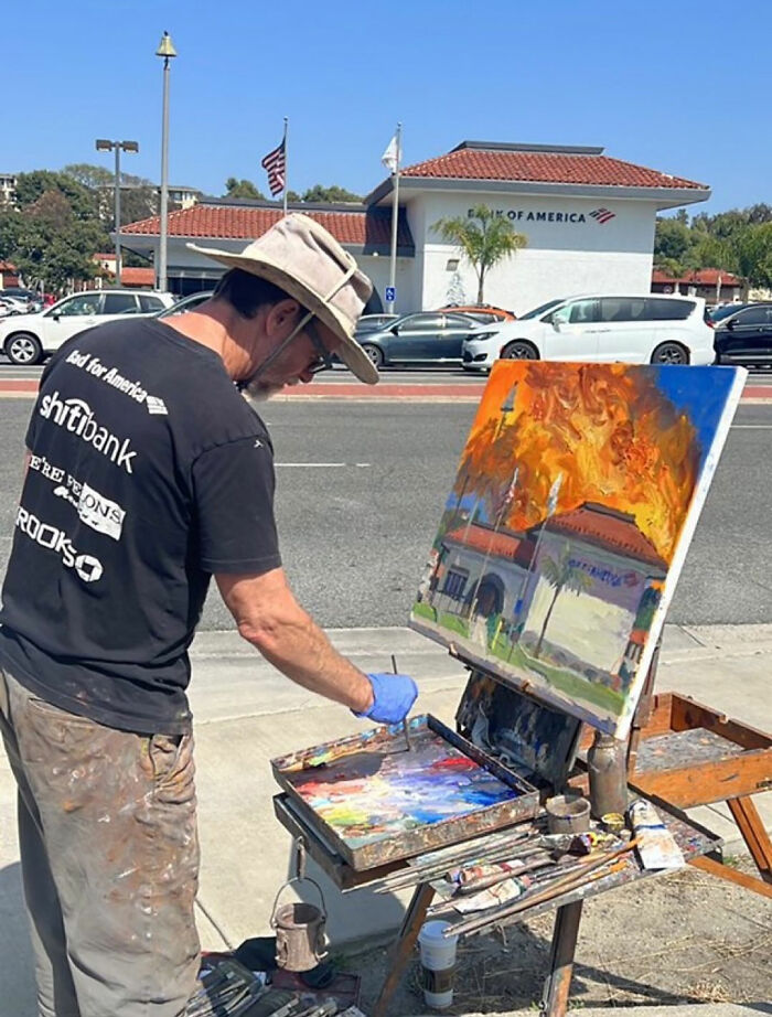 Painter capturing a scene of a bank with an unusual twist, making observers go 'Hmmm' in curiosity.